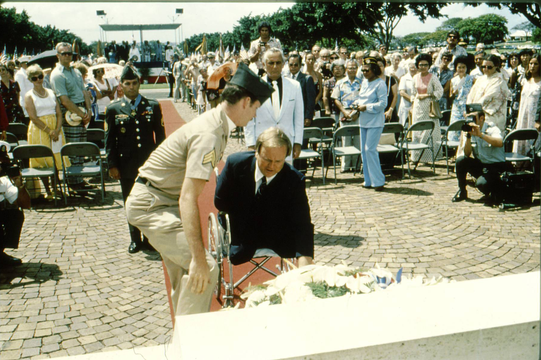 Max Cleland, a Vietnam veteran, and head of the Department of Veterans Affairs at the time, laid a wreath as part of the Memorial Day 1980 ceremony at the Honolulu Memorial. Cleland would later serve as the Secretary of ABMC (2009-2017).