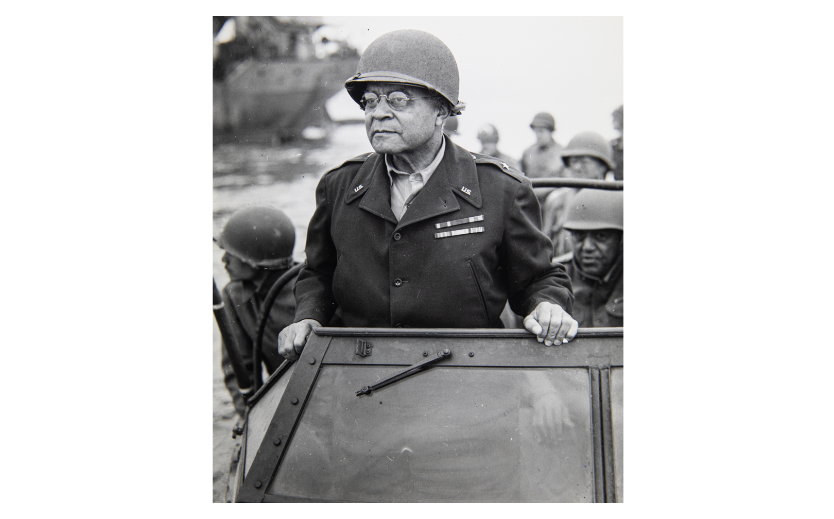 Brig. Gen. Benjamin O. Davis watches a Signal Corps crew erecting poles, in France, Aug. 8, 1944. ©NARA