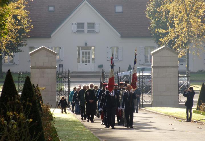 Participants march into the cemetery for the ceremony.