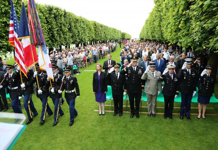 Attendees stand at the beginning of the ceremony. 