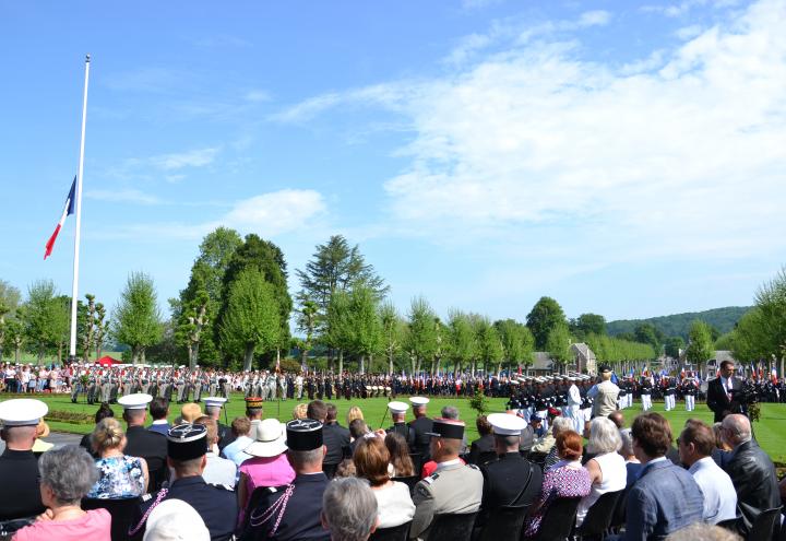 Attendees sit as they watch members of the military participate in the ceremony.