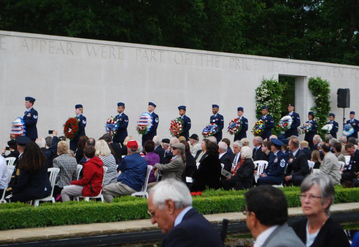 Floral wreaths are carried by members of the U.S. military. 