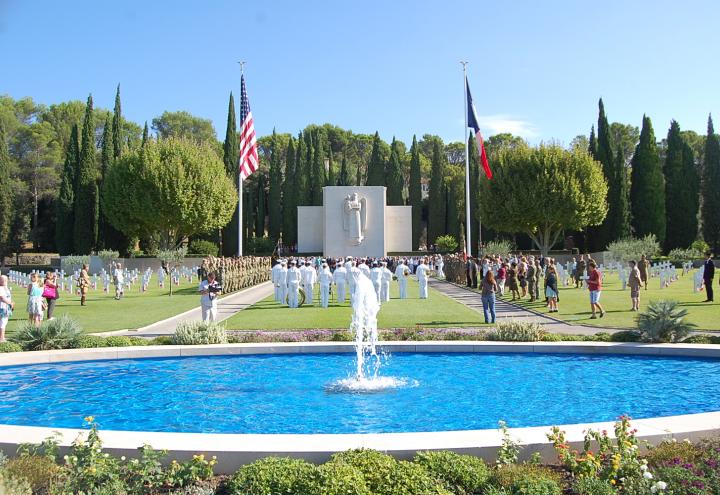 Attendees gather near the chapel for ceremony. 