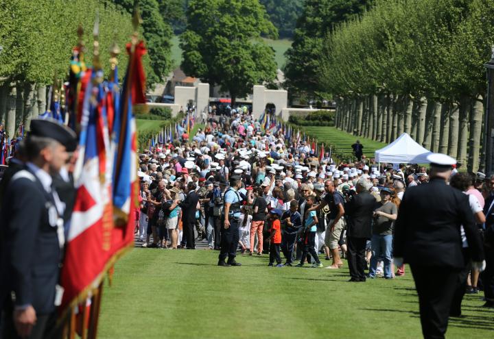 Throngs of people fill the main entrance area.