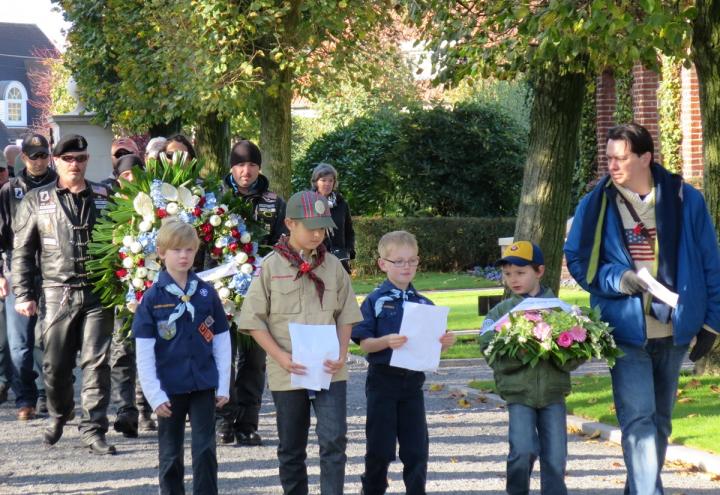 Boy scouts walk into the cemetery for the ceremony. 