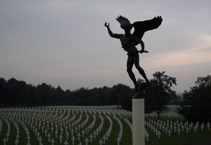 An angel statue looks over the rows of headstones at Henri-Chapelle American Cemetery.