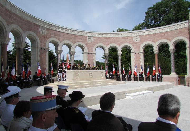 Staff place American and Belgian flags in front of every headstone. 