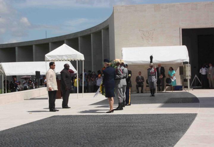 Participants stand with a wreath during the 2012 Veterans Day ceremony at Manila American Cemetery. 