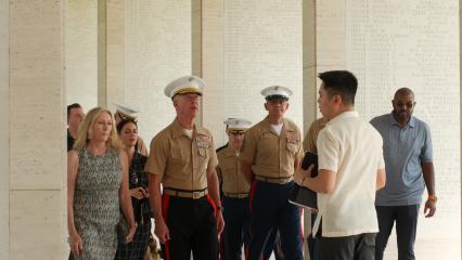 Group of visitors with Vicente Lim IV (Vincci) Manila Visitor Center Director including Commandant of the Marine Corp, walking through the Manila American Cemetery.