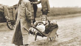 Belgian refugees walk towards Waregem, to return to areas liberated by American units.