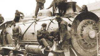 Services of Supply (SOS) soldiers build a locomotive at the assembly plant in St. Nazaire.