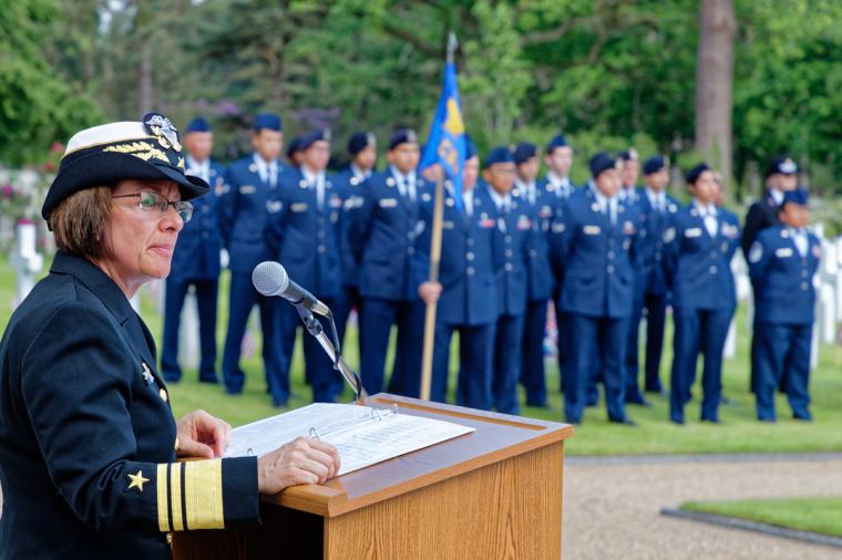 A woman in uniform delivers remarks from the podium. 