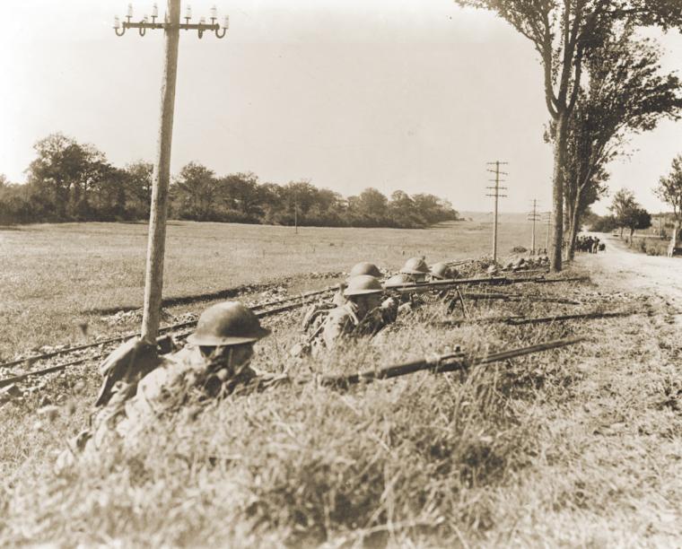 Soldiers of Company B, 165th Infantry Regiment, 42nd Division, at the ready, September 1918.