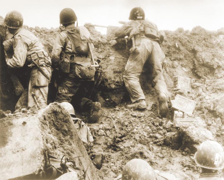 Rangers defend the cliffs at Pointe du Hoc.