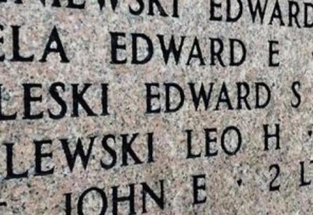 A bronze rosette is placed next to the name of Edward S. Kovaleski